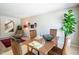 Dining area featuring wood table and chairs, tile flooring, and sight into living room at 11025 N 10Th St, Phoenix, AZ 85020