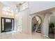 Spacious entryway showcasing high ceilings, a grand staircase, and stylish chandelier, complemented by tile flooring at 11025 N 10Th St, Phoenix, AZ 85020