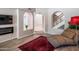 Comfortable living room featuring curved archways, wood flooring, a modern electric fireplace, and a cozy chaise lounge at 11025 N 10Th St, Phoenix, AZ 85020
