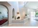 Bright living space features architectural archways, fireplace, and seamless flow into kitchen and dining areas at 11025 N 10Th St, Phoenix, AZ 85020