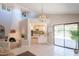 Open concept living space featuring high ceilings, natural light, and seamless flow to the kitchen and outdoor patio at 11025 N 10Th St, Phoenix, AZ 85020