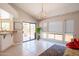 Open-plan living area with tile floors, sliding glass doors to patio, and a neutral color palette at 11025 N 10Th St, Phoenix, AZ 85020