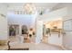 Open living space features high ceilings, clerestory windows, staircase, and kitchen access at 11025 N 10Th St, Phoenix, AZ 85020