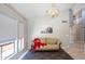 Inviting living room featuring a high ceiling, a cozy sofa, and neutral décor at 11025 N 10Th St, Phoenix, AZ 85020