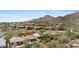 Stunning aerial view of luxurious homes nestled in a desert community with mountain views at 11081 E Betony Dr, Scottsdale, AZ 85255