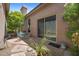 Charming back patio with outdoor seating area, mature trees, and convenient access from the sliding glass door at 11081 E Betony Dr, Scottsdale, AZ 85255