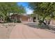 Beautiful, single-story home featuring mature desert landscaping and a neutral color scheme at 11081 E Betony Dr, Scottsdale, AZ 85255