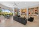 Bright living area features built-in shelving, tile floors, and large windows with views at 11081 E Betony Dr, Scottsdale, AZ 85255