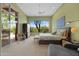 Spacious main bedroom with large windows offering scenic views and a sitting area near the sliding glass doors at 11081 E Betony Dr, Scottsdale, AZ 85255