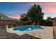 Private backyard pool features desert landscaping and is perfect for enjoying the Arizona sunshine at 11866 N 143Rd Ave, Surprise, AZ 85379
