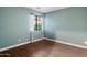 Clean bedroom with hardwood flooring and a window with lots of natural light at 11866 N 143Rd Ave, Surprise, AZ 85379
