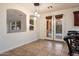 Cozy breakfast nook with tile flooring and view of outdoor pool at 11866 N 143Rd Ave, Surprise, AZ 85379