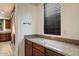 Granite countertop in the kitchen with a window view and decorative wall accessories at 11866 N 143Rd Ave, Surprise, AZ 85379