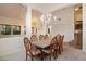 Bright dining room with chandelier and decorative chairs at 11866 N 143Rd Ave, Surprise, AZ 85379