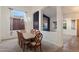 Charming dining room with chandelier, large window, and decorative chairs at 11866 N 143Rd Ave, Surprise, AZ 85379