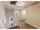 Upstairs hallway with wood flooring and an arched doorway with a view of the bathroom at 11866 N 143Rd Ave, Surprise, AZ 85379