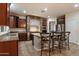 Gourmet kitchen with stone accents, stainless steel appliances, and granite countertops at 11866 N 143Rd Ave, Surprise, AZ 85379