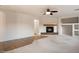 Spacious living room features carpet, tile, fireplace, and neutral walls and trim at 11866 N 143Rd Ave, Surprise, AZ 85379