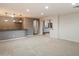 Large living room featuring a bar and arched openings leading to other rooms at 11866 N 143Rd Ave, Surprise, AZ 85379