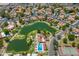 An elevated shot showcasing a community's pools, lakes, tennis courts, and common areas at 1338 E Greenway Cir, Mesa, AZ 85203