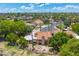 Aerial view of a home showcasing its tile roof, backyard, and community at 1338 E Greenway Cir, Mesa, AZ 85203