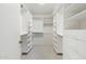 Spacious walk-in closet with custom shelving, and ample storage space for organization at 1338 E Greenway Cir, Mesa, AZ 85203