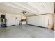Spacious garage with ample storage, featuring built-in cabinets and a clean, organized layout at 1338 E Greenway Cir, Mesa, AZ 85203