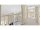 Bright hallway with railing overlooking living area, decorative window for added charm at 1338 E Greenway Cir, Mesa, AZ 85203