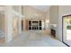 Spacious living room with soaring ceilings, fireplace, and built-in entertainment center at 1338 E Greenway Cir, Mesa, AZ 85203