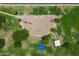 Aerial view of a playground with play equipment, basketball court, park, and walking paths at 1338 E Greenway Cir, Mesa, AZ 85203