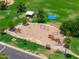Aerial view of a playground with swings, slides, play equipment, and surrounding green space at 1338 E Greenway Cir, Mesa, AZ 85203