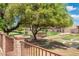 Scenic view of a pond with a charming bridge surrounded by lush greenery at 1338 E Greenway Cir, Mesa, AZ 85203