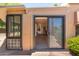 Sliding glass doors lead from patio to bright sunroom, offering seamless indoor-outdoor living at 1338 E Greenway Cir, Mesa, AZ 85203
