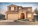 Charming stucco two-story home featuring an attached garage, beautiful landscaping, and a tile roof at 13763 W Calle De Baca --, Peoria, AZ 85383