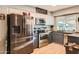 Galley kitchen featuring stainless steel appliances and ample cabinet space at 13802 N 37Th Dr, Phoenix, AZ 85053
