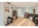 Bright and airy living room with hardwood floors, a large window, and neutral paint at 13802 N 37Th Dr, Phoenix, AZ 85053