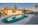 An inviting pool with a covered patio is nestled in the backyard, creating a perfect space for outdoor living and relaxation at 13802 N 37Th Dr, Phoenix, AZ 85053