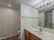 Well-lit bathroom boasts a stylish vanity with a sink and a shower and tub combo at 1402 E Guadalupe Rd # 122, Tempe, AZ 85283
