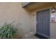 Ground floor entrance with security door and exterior lighting at 1402 E Guadalupe Rd # 122, Tempe, AZ 85283