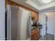 The kitchen includes stainless steel appliances, wood cabinetry, and in-unit washer and dryer at 1402 E Guadalupe Rd # 122, Tempe, AZ 85283