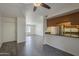 Open-concept living room with breakfast bar, hard surface floors, and a sliding glass door at 1402 E Guadalupe Rd # 122, Tempe, AZ 85283
