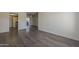 Spacious living room featuring wood-look flooring and a patio, seamlessly connecting indoor and outdoor spaces at 1402 E Guadalupe Rd # 122, Tempe, AZ 85283