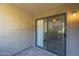 Cozy patio featuring an outdoor lighting fixture and a sliding glass door that enhances natural light at 1402 E Guadalupe Rd # 122, Tempe, AZ 85283