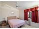 Bedroom featuring natural light, a ceiling fan, and neutral color palette at 14186 N 100Th Pl, Scottsdale, AZ 85260