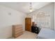 Bright bedroom with ceiling fan and window at 14186 N 100Th Pl, Scottsdale, AZ 85260