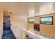 Bright hallway with high ceilings and a view overlooking the living room at 14186 N 100Th Pl, Scottsdale, AZ 85260