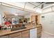 Kitchen with a breakfast bar that offers a view into a Gathering room with a pool view at 14186 N 100Th Pl, Scottsdale, AZ 85260