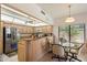 Eat-in kitchen features stainless steel appliances and a breakfast bar with seating at 14186 N 100Th Pl, Scottsdale, AZ 85260