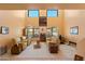 Spacious living room with high ceilings, large windows, and comfortable seating arrangement at 14186 N 100Th Pl, Scottsdale, AZ 85260