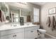 Bathroom featuring dual sinks, large mirrors, and neutral wall colors creating a relaxing ambiance at 20926 E Longwood Dr, Queen Creek, AZ 85142